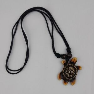 Carved Wooden Island Patterned Turtle Necklace